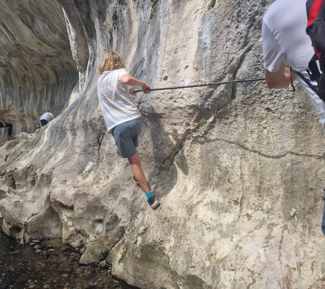 child climbing Cheile Băniței or Bănița Gorge which is one of the hidden gems of Romania - taken by Alexandra in England